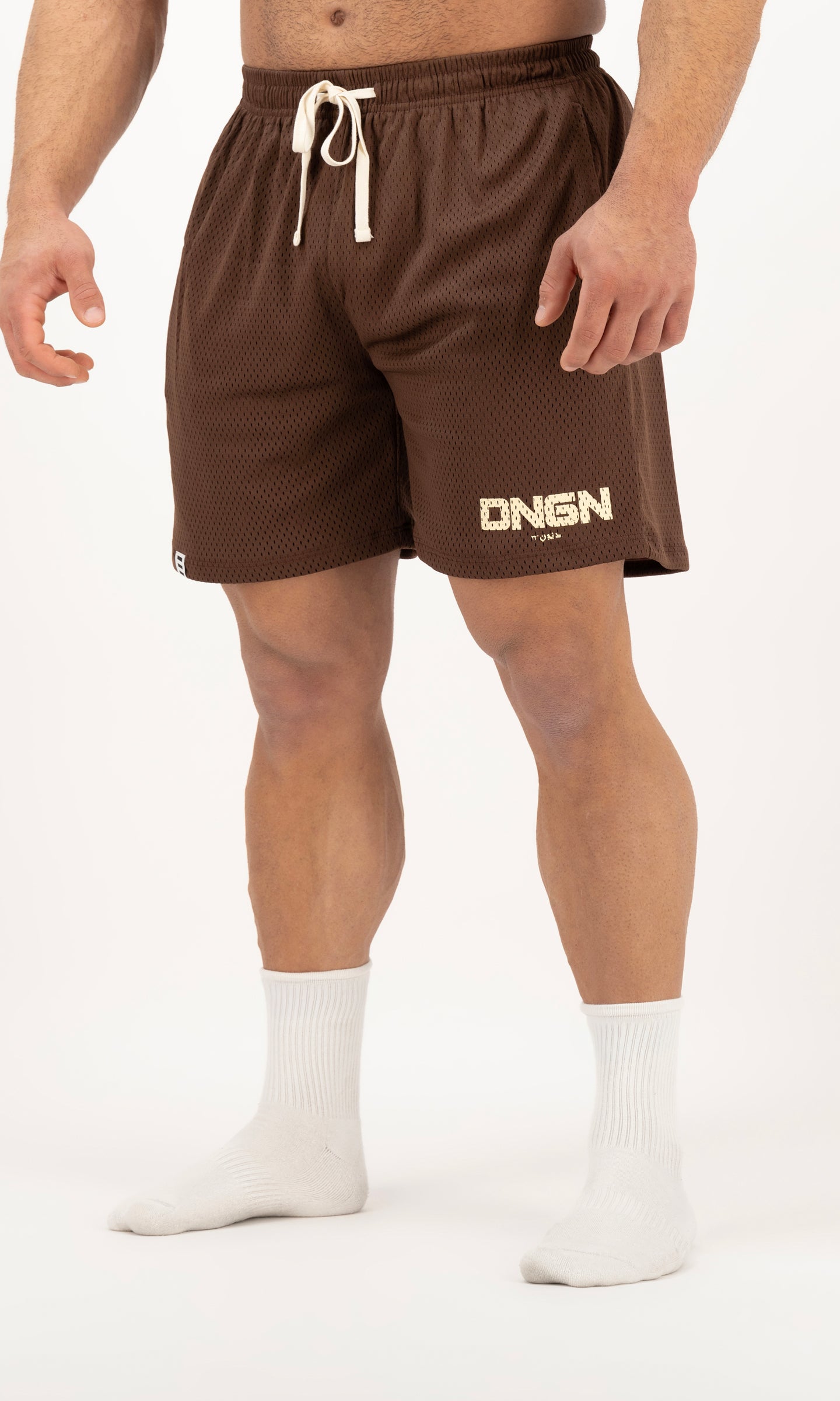 Brown shorts with a brand logo on a white background