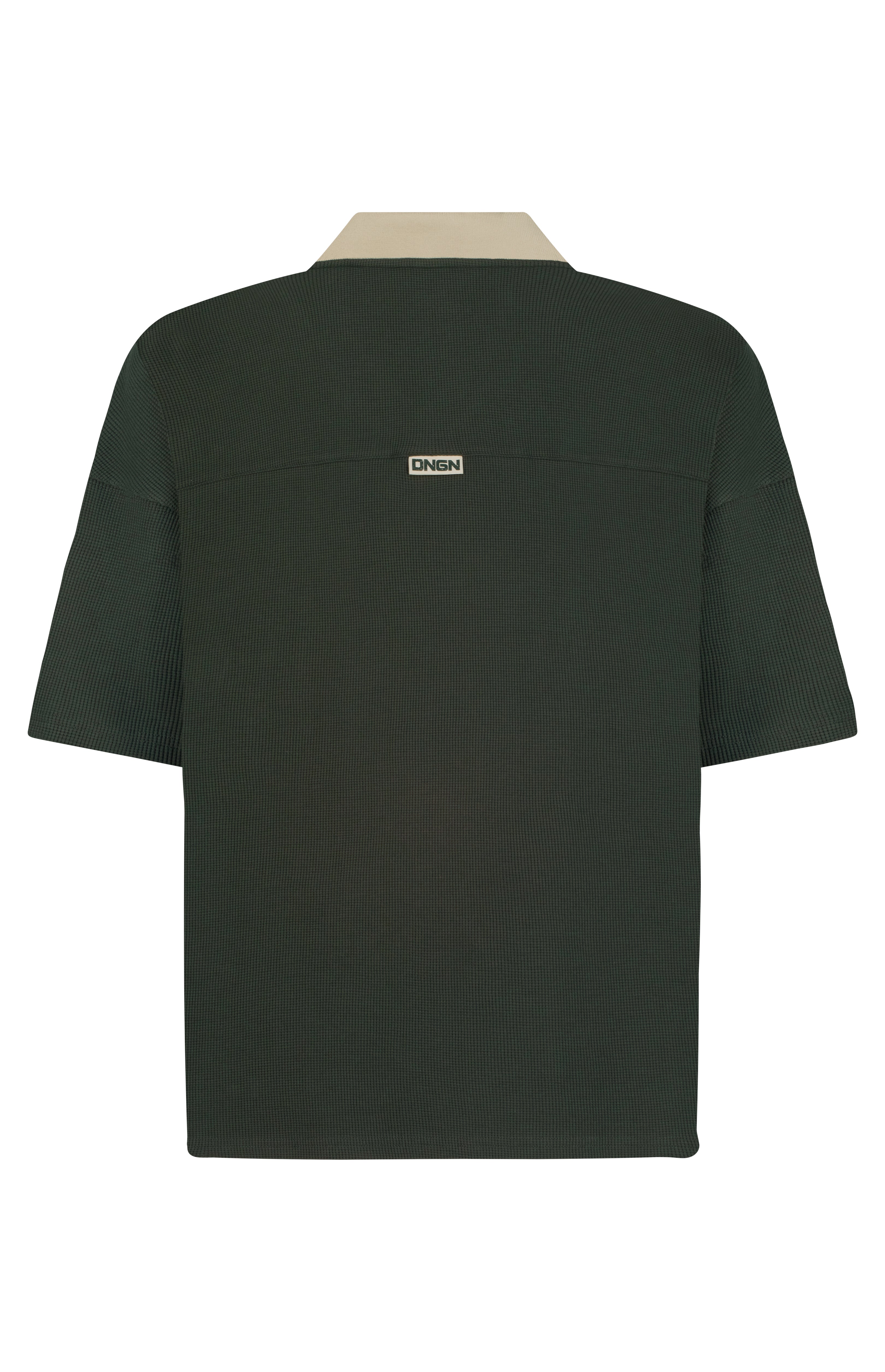 Green shirt with a brand logo on the back against a white background